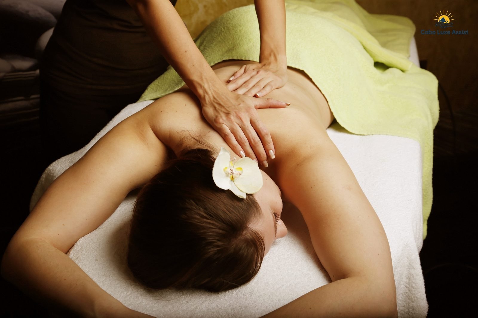 Spa massage with orchid and lime towel in a quiet Cabo treatment room